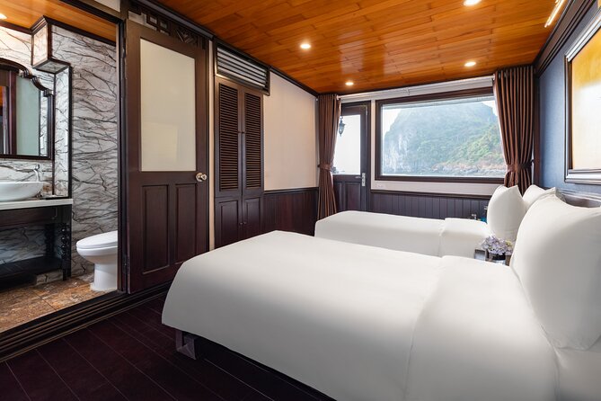 2-Day Boutique Cruise Discover Hidden Gems of Bai Tu Long Bay - Day 2: tai chi at dawn, breakfast onboard, and the return route