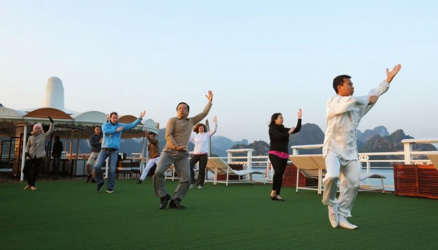 2-Day On 5 Star Cruise Halong Bay with Meals and Kayaking - Day 2: Taichi warm-up, Tra Bau scenes, and Lan Ha Bay views