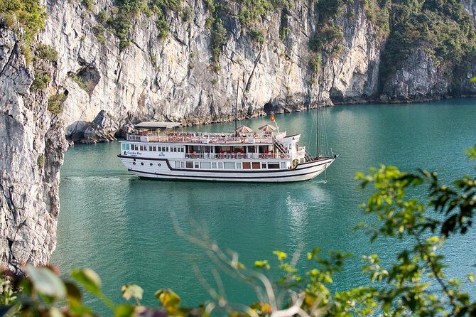 Bai Tu Long Bay Boutique Cruise: Visit Bai Tu Long bay & Overnight boat in 2 day - Day 2 morning routine: Tai Chi, caves (or chill time), and return to Hanoi