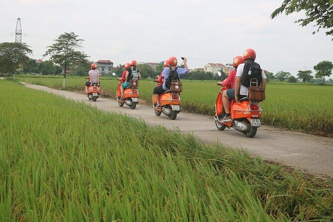 Beautiful Female Riders Vespa Red River Countryside Tour 5 Hours - Local market and a family visit: the everyday Hanoi that’s hard to schedule on your own