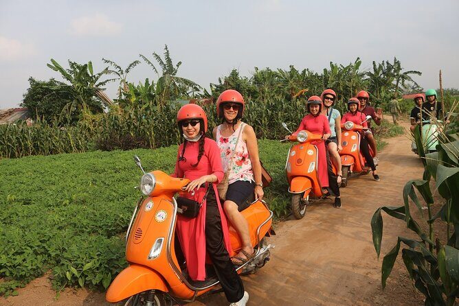 Beautiful Female Riders Vespa Red River Countryside Tour 5 Hours - Riding into farm views: fruit-farm scenes and photo time