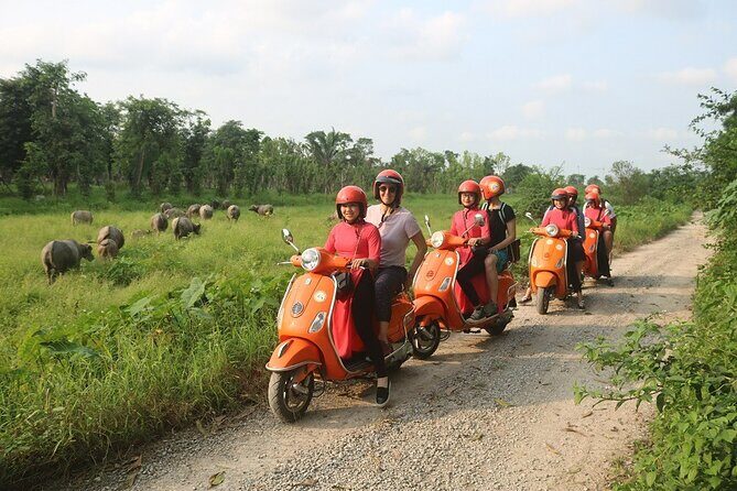 Beautiful Female Riders Vespa Red River Countryside Tour 5 Hours - First stop: Long Bien Bridge and that quick “we’re really going” feeling