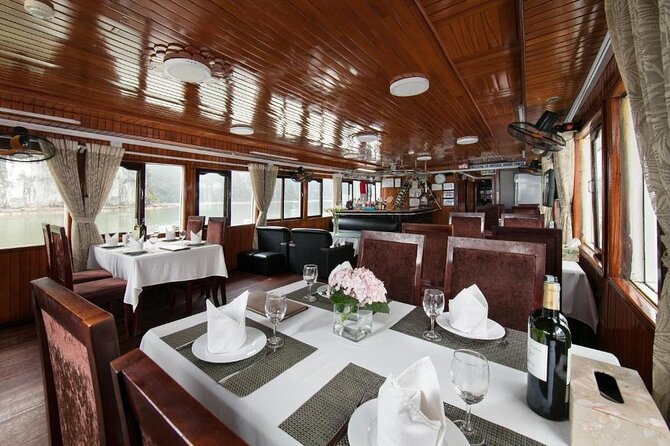 BOUTIQUE CRUISES Halong Bay 2 Days,1 Night Tour: Swimming,Caving, and Kayaking - Sunset on the deck: the best “pause” moment
