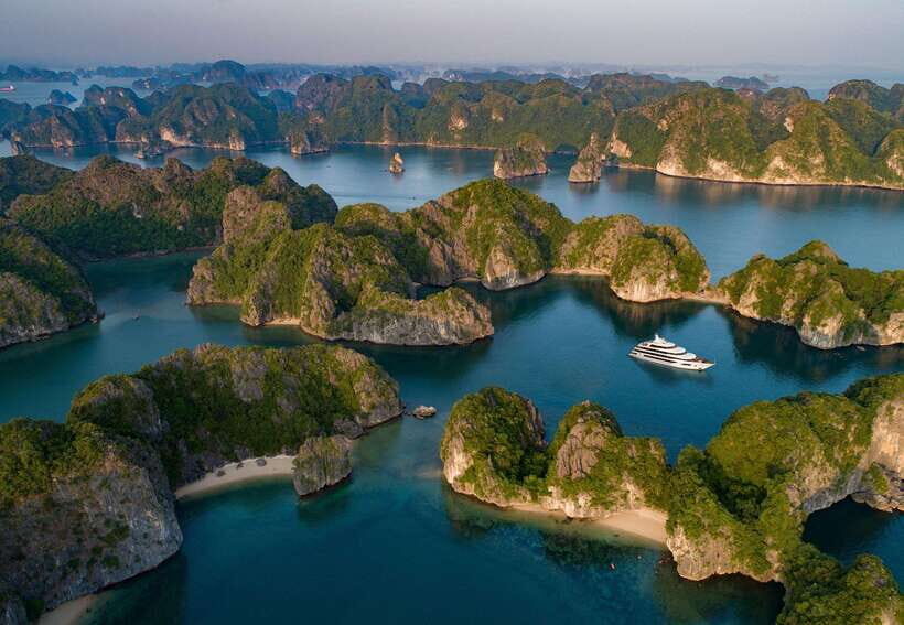 Cat Ba: Full- day trip with biking, kayaking, meal, tickets - Viet Hai village by bike: rice fields, fishermen, and fish massage