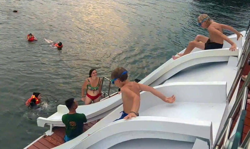 D'Charme Luxury Day Cruise Discover the Stunning Lan Ha Bay - Swim time at 1:45: crystal-clear water, towels, and options
