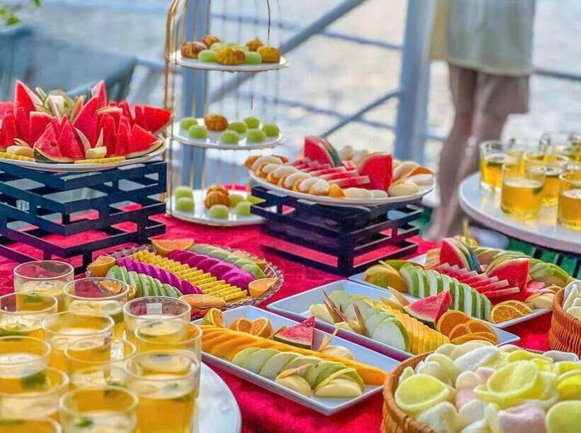 D'Charme Luxury Day Cruise Discover the Stunning Lan Ha Bay - Afternoon tea party at 2:30: fruits, tropical juices, and relaxing music