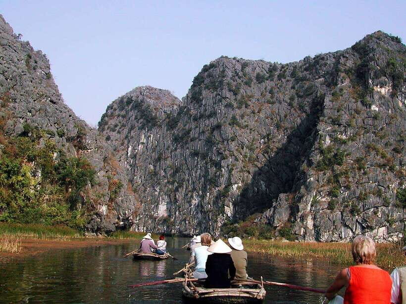 From Hanoi: Bai Dinh, Trang An Mua Cave - A Scenic Day Tour - Trang An by Wooden Boat: Caves, Karst, and Crowds