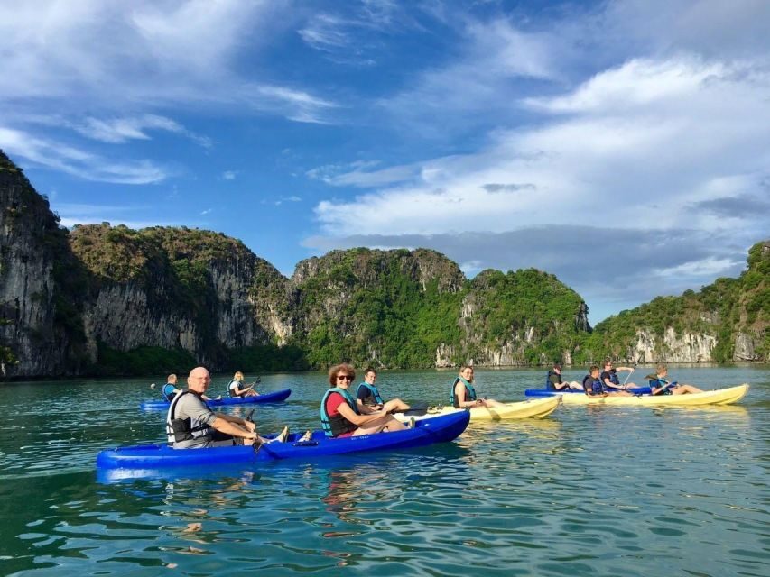 From Hanoi: Halong Bay Cruise 2 Days 1 Night With Transport - Sunset on the sundeck: easy group time with fruit and music