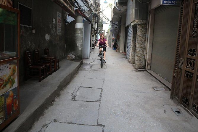 Half-Day Bicycle Tour Combine City & Countryside + Train Street - Long Bien Bridge: pedaling over a 1902 Eiffel-era symbol