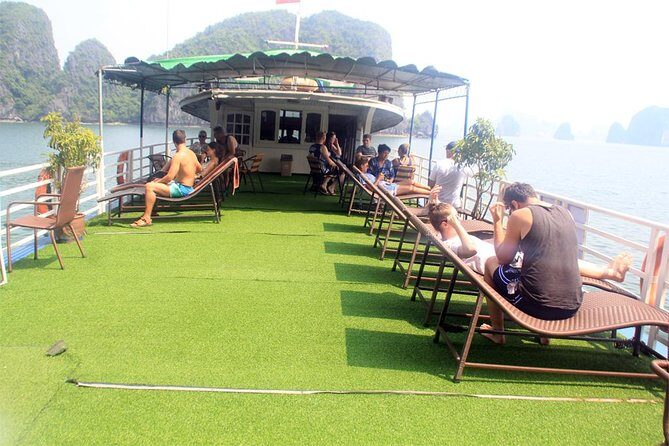 Halong bay full day trip: Visit Surprise cave, Titop island, kayaking & swimming - The guide factor: Tony and Que (We) style of management
