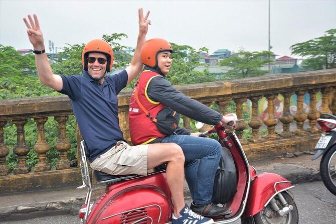 Hanoi By Vespa Tours: HISTORY + CULTURE + SIGHT + FUN 2,5 Hours - From Opera House toward Long Bien Bridge: backstreets, Dong Xuan, and the city scale