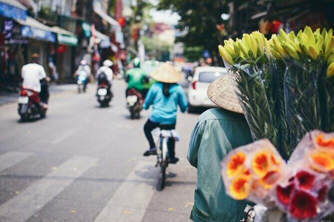 Hanoi City Motorbike Tour with Banana Island and Local Food - Stop 3: Long Bien Bridge, Train Street, and the Hanoi Action Shot