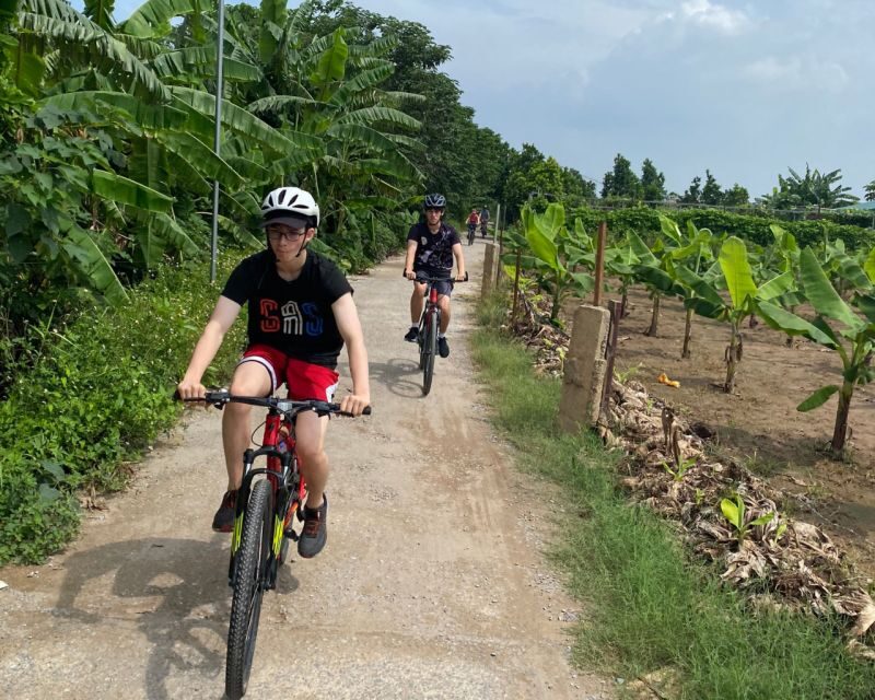 Hanoi Countryside Bicycle Tour - Long Bien Bridge versus a small boat across the Red River