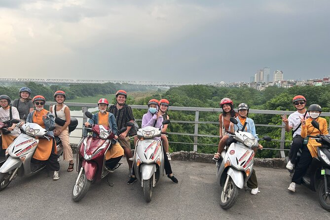 Hanoi Motorbike Tours: Hanoi Motorbike Food Tours Led By Women - Long Bien Bridge and the Ho Chi Minh monument at night