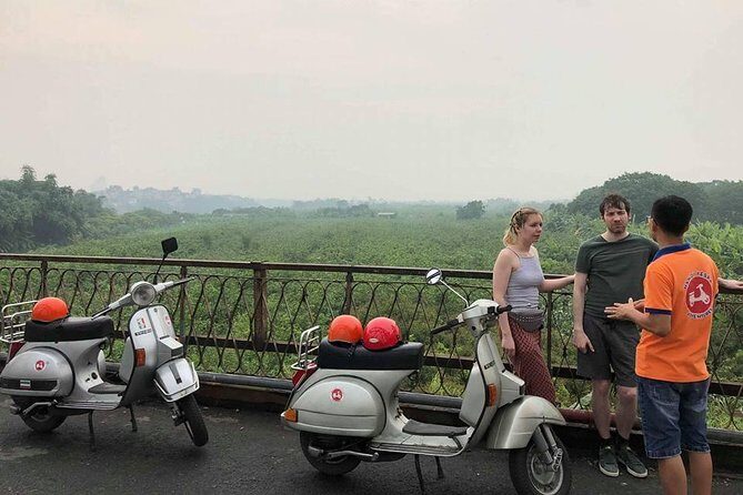 HANOI MUST SEE SITES Vespa Tour - Stop 5: Long Bien Bridge and the Mosaic Wall