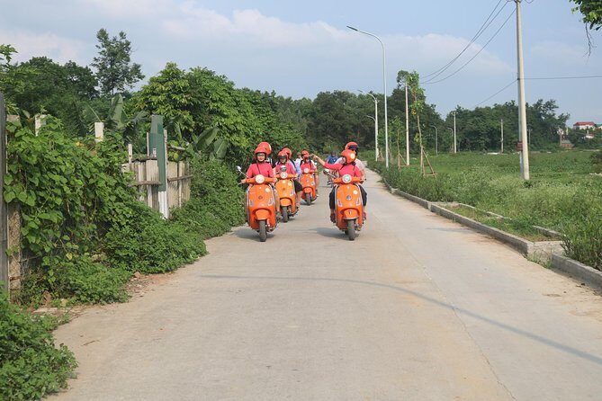 Hanoi Vespa Full Day City & Countryside with Female Ao Dai Riders - Long Bien Bridge: Red River views from vintage-style cruising