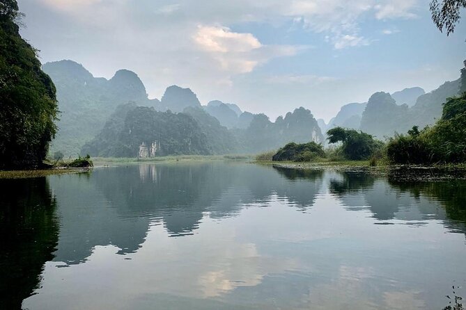 Hoa Lu - Tam Coc - Mua Cave Full Day - LIMOUSINE - Cycling after the boat: pedaling through karst and reaching the pagoda area