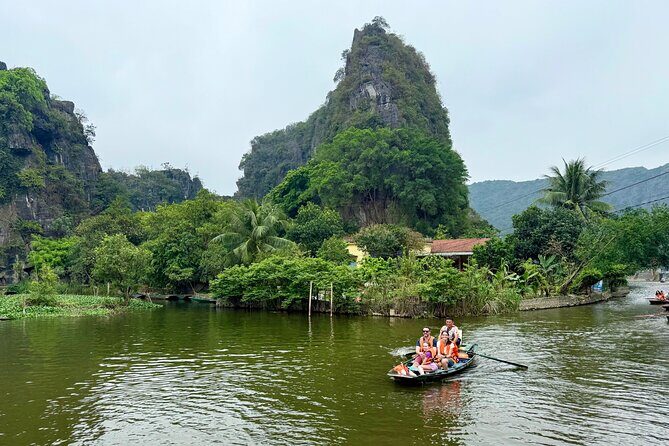 Ninh Binh Day Escape from Hanoi: Local Life, Connection & Tales - Tam Cốc by Sampan Boat: Rice Paddies, Limestone Cliffs, and Cave Passages