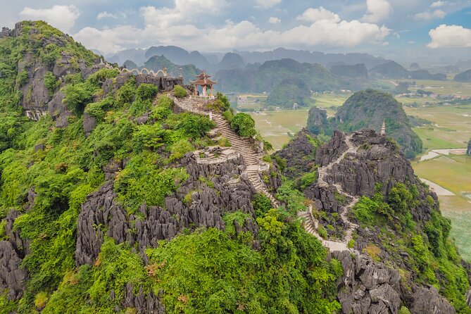 Ninh Binh Group Tour of 11 from Hanoi via Mua Cave Tam Coc Hoa Lu - Guide Power: How QA and Nien Make the Day Click
