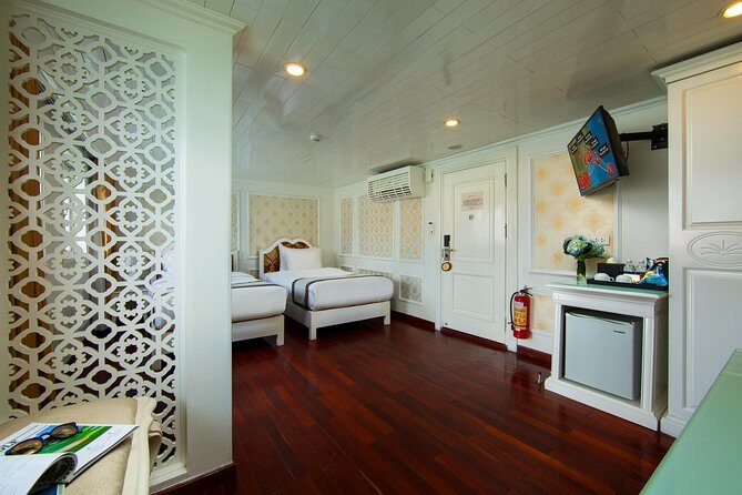 (Official) Signature Royal Cruise - 02 days 01 night program - Day 1 in Ha Long Bay: floating village, kayaking, sauna breaks, and gala dinner